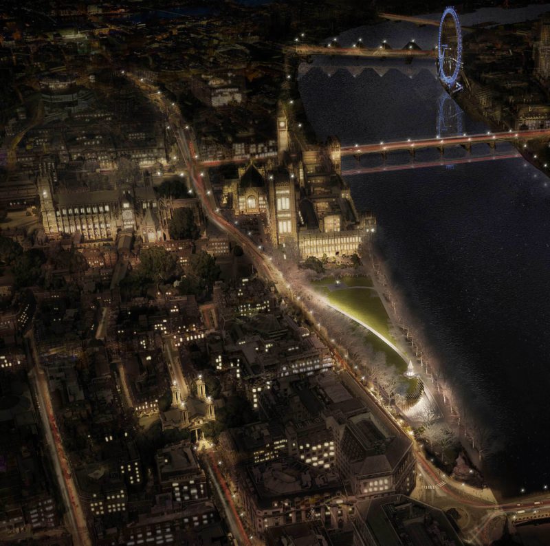 Adjaye Associates and Ron Arad Architects concept render: night aerial view of Westminster with the memorial's entrance illuminated on the riverbank beside the Palace of Westminster and the London Eye
